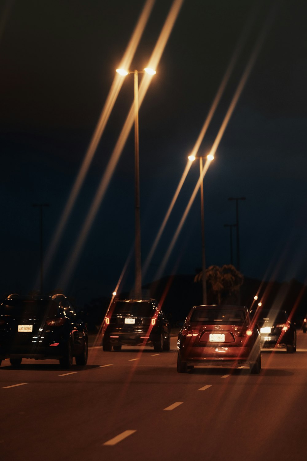 cars on a road at night