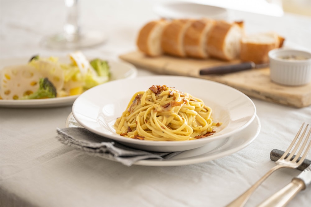 a plate of pasta and bread