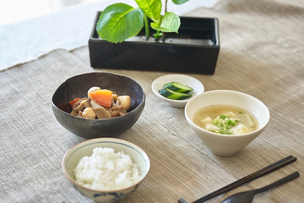 a group of bowls with food in it