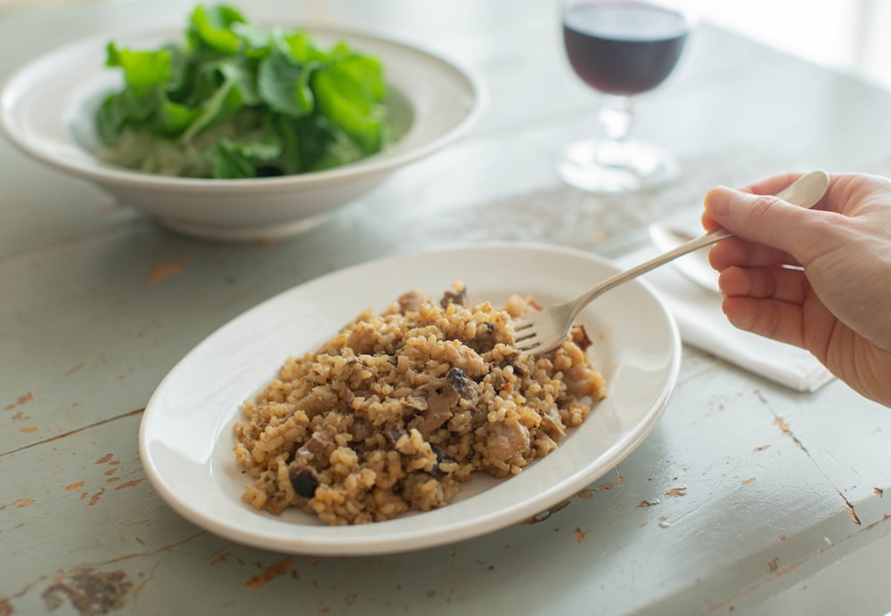 a person eating a bowl of food