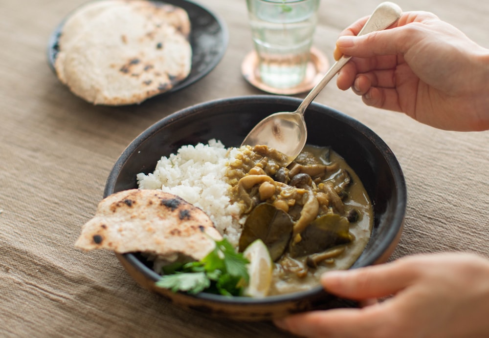 a bowl of soup with a spoon