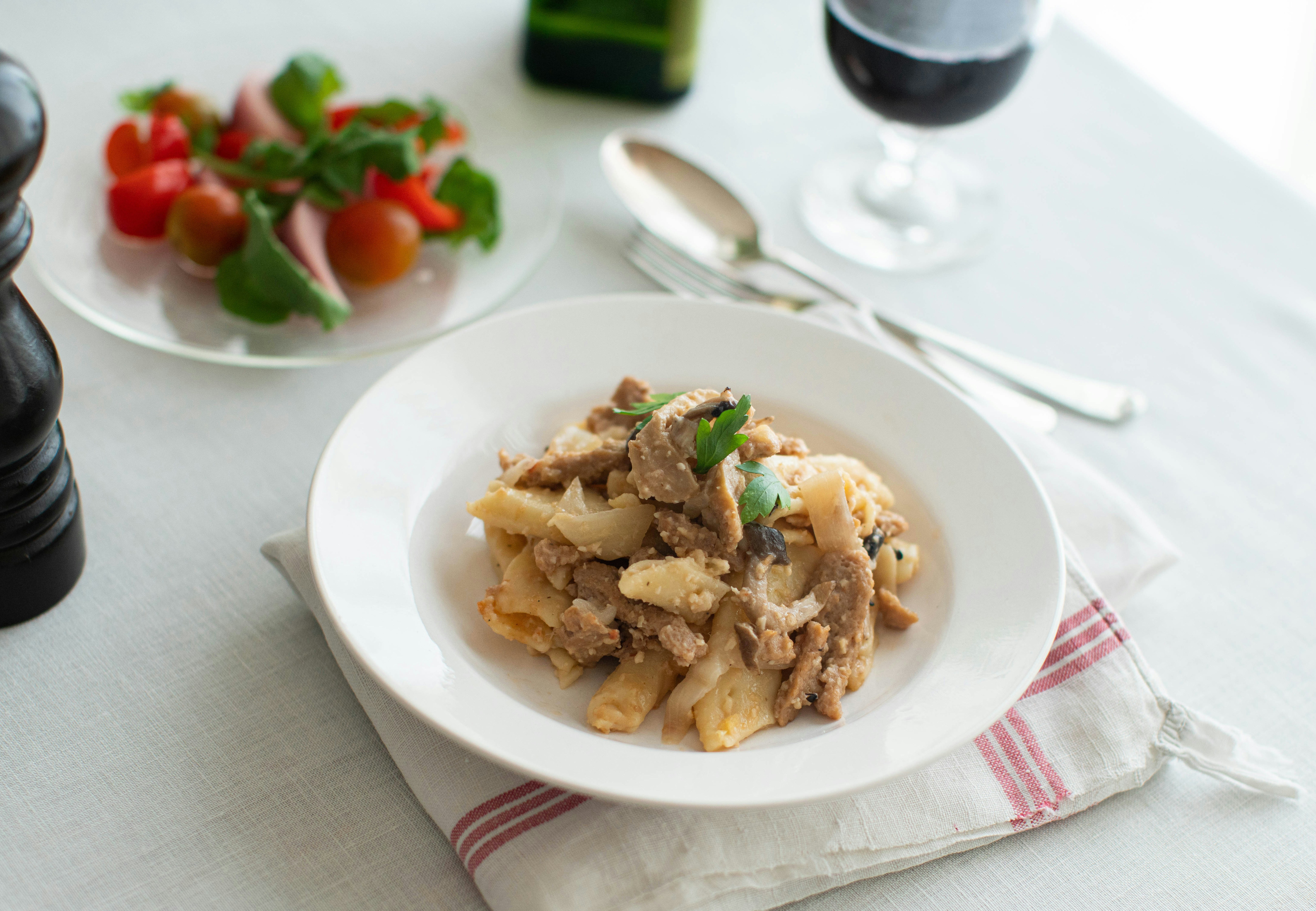 a plate of food and a bowl of salad