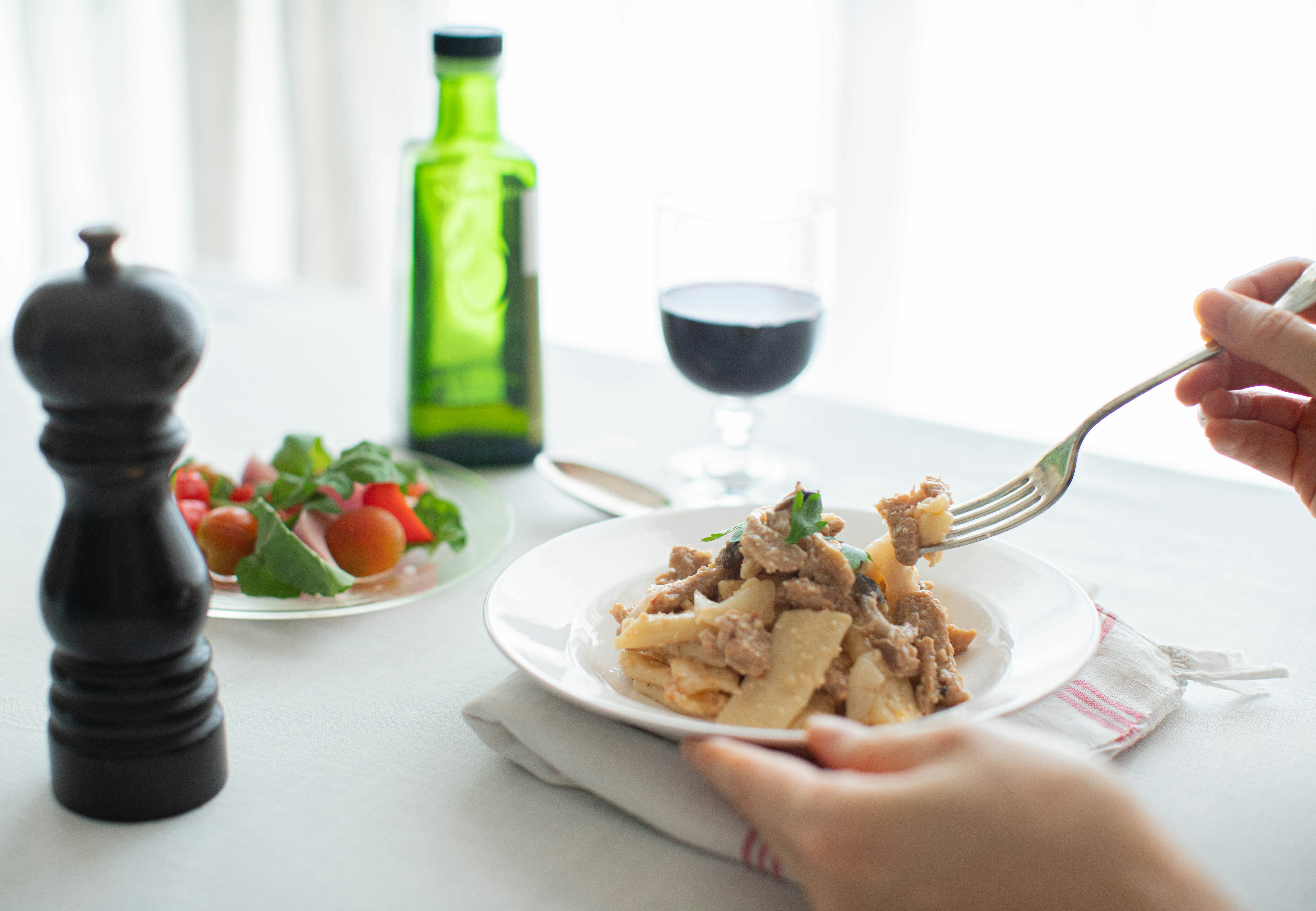 a person eating food at a table