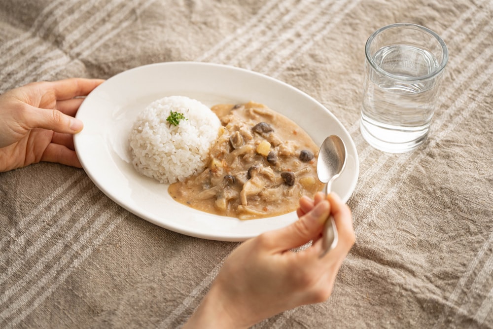 a plate of food and a glass of water