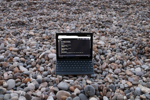 a small black device on a rocky surface