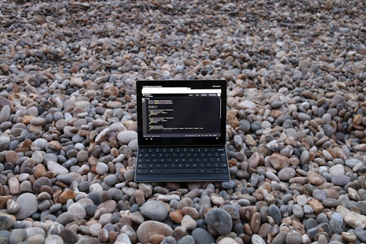 a small black device on a rocky surface
