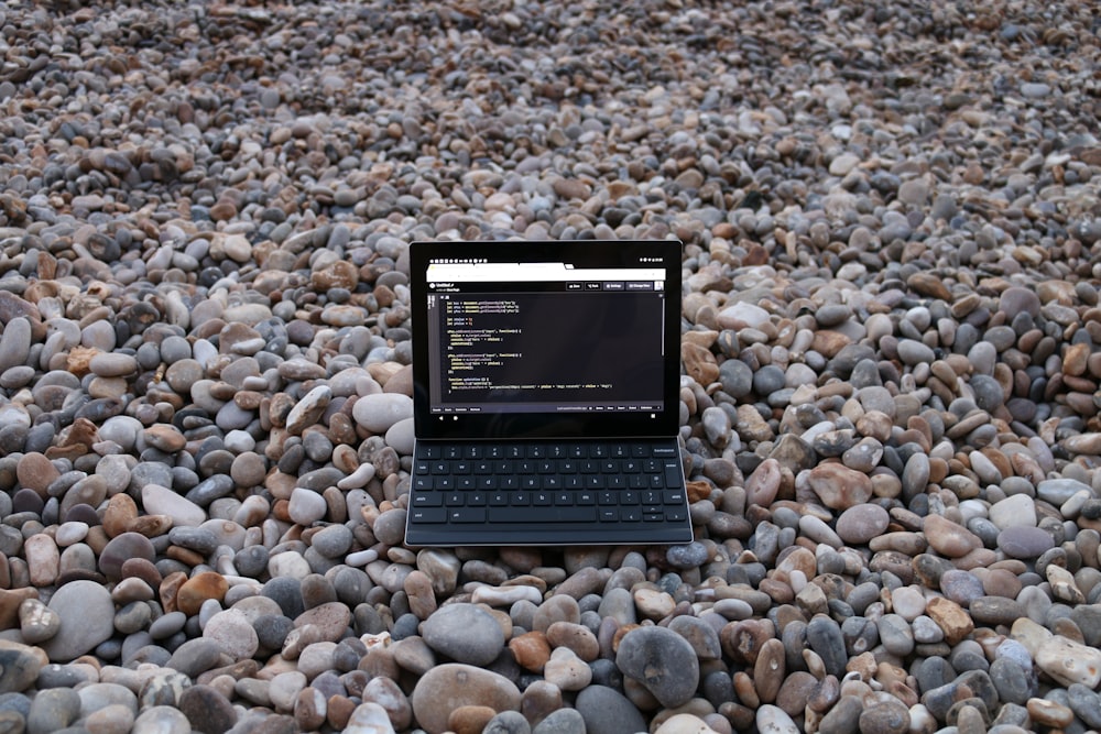 a small black device on a rocky surface