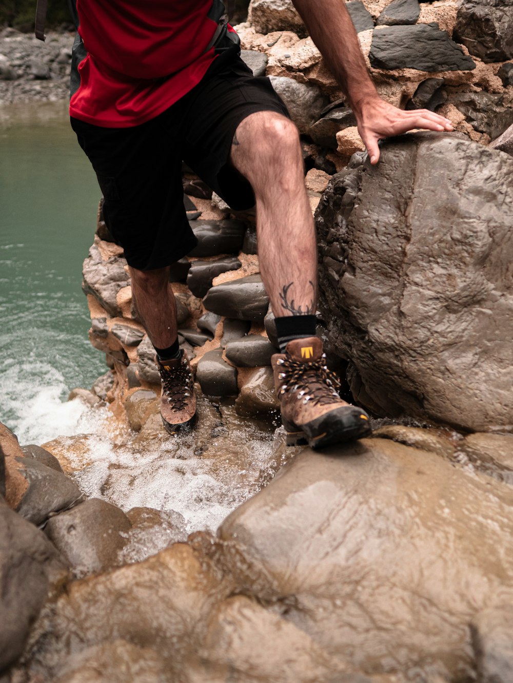 a man climbing a rock