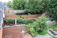 A detailed view of a custom fencing installation in a backyard.