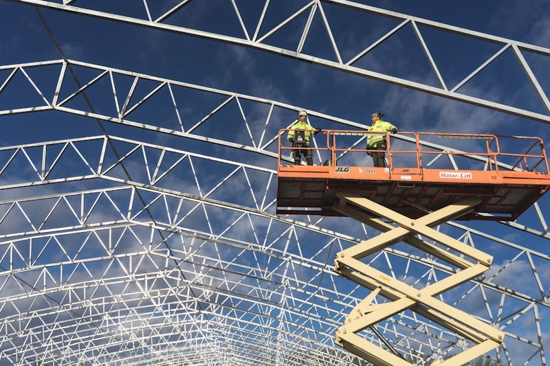 Workers on crane during steel erection