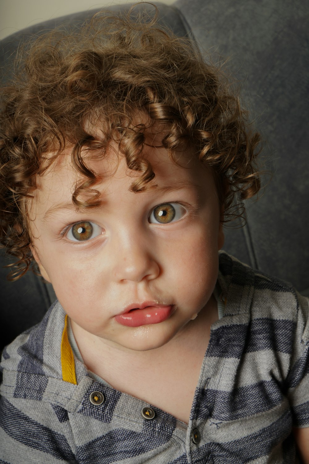 a boy with curly hair