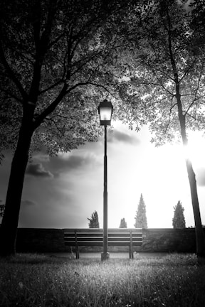 a bench next to a lamp post
