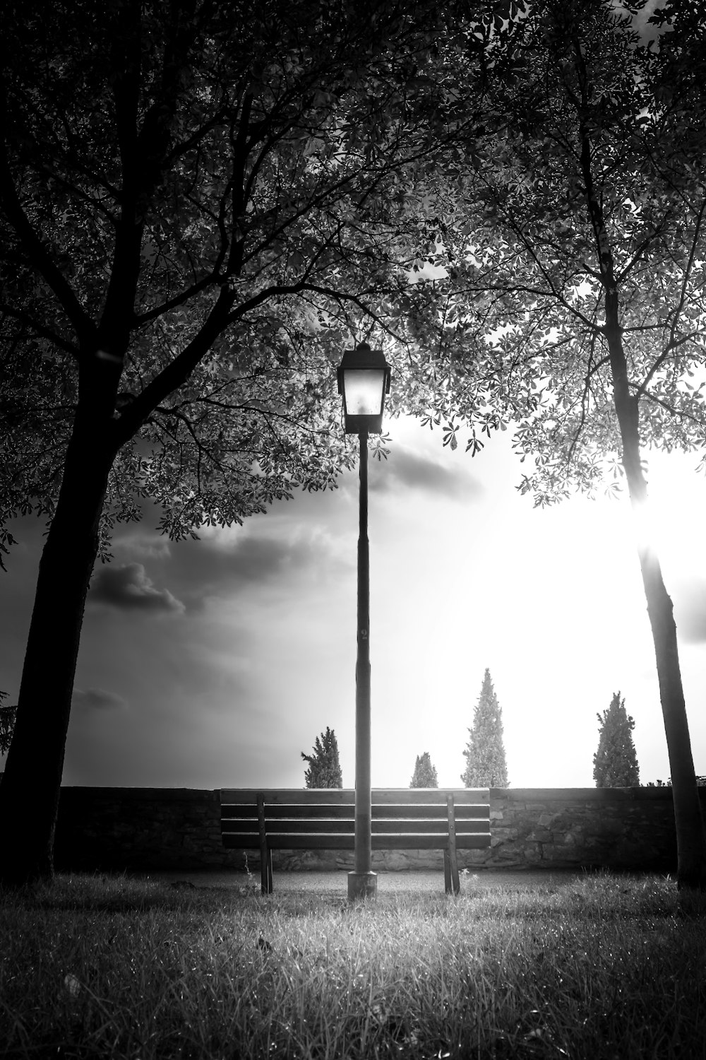 a bench next to a lamp post