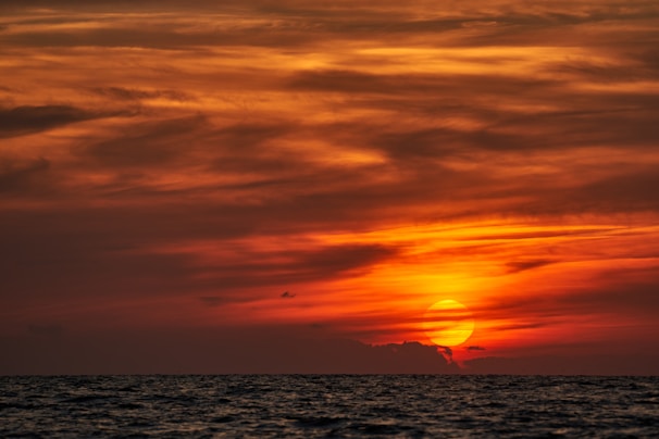 a sunset over the water