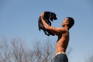 a man holding a dog