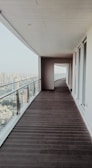Balcony glazing project in The Hague showing panoramic city views.