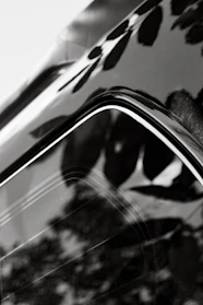 Close-up of a shiny car surface reflecting light after applying nano ceramic coating