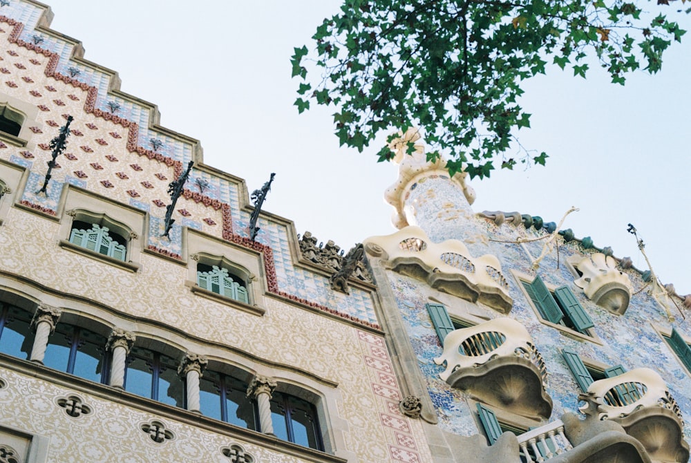 a building with a tree in the front