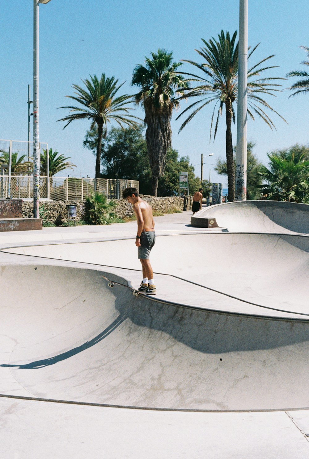 a man riding a skateboard at a skate park
