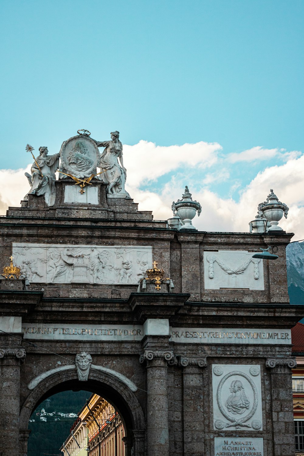 a building with statues on the roof