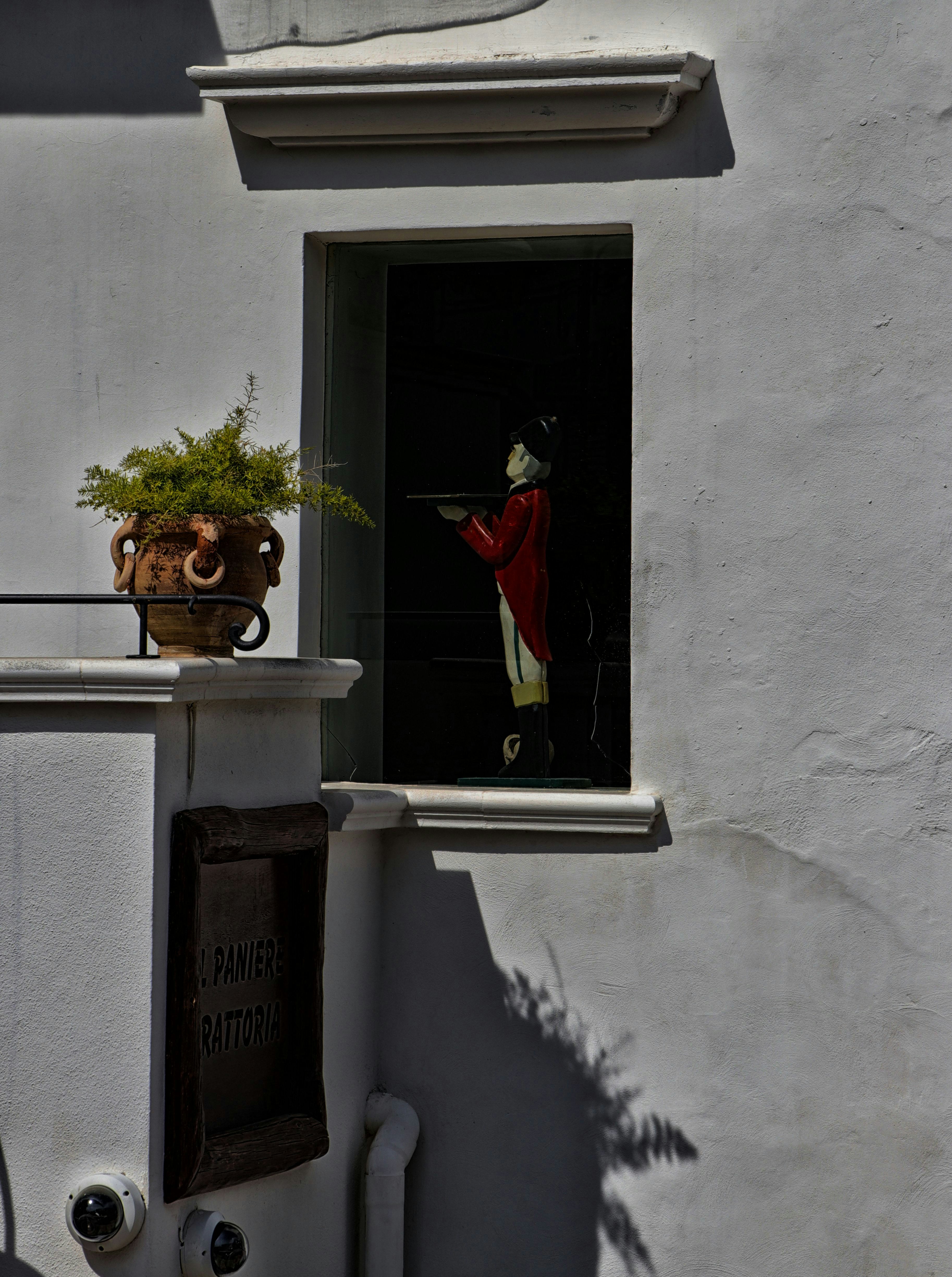 a statue in a window