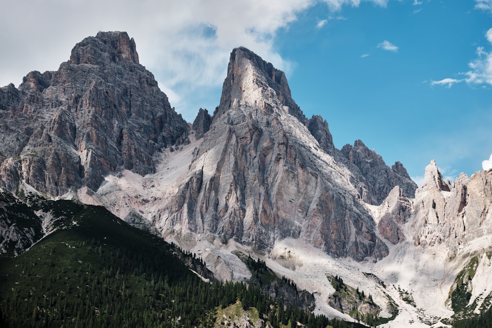 a rocky mountain with snow