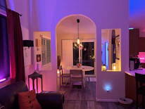Cozy therapy room with blue translucent glass elements and soft yellow lighting.