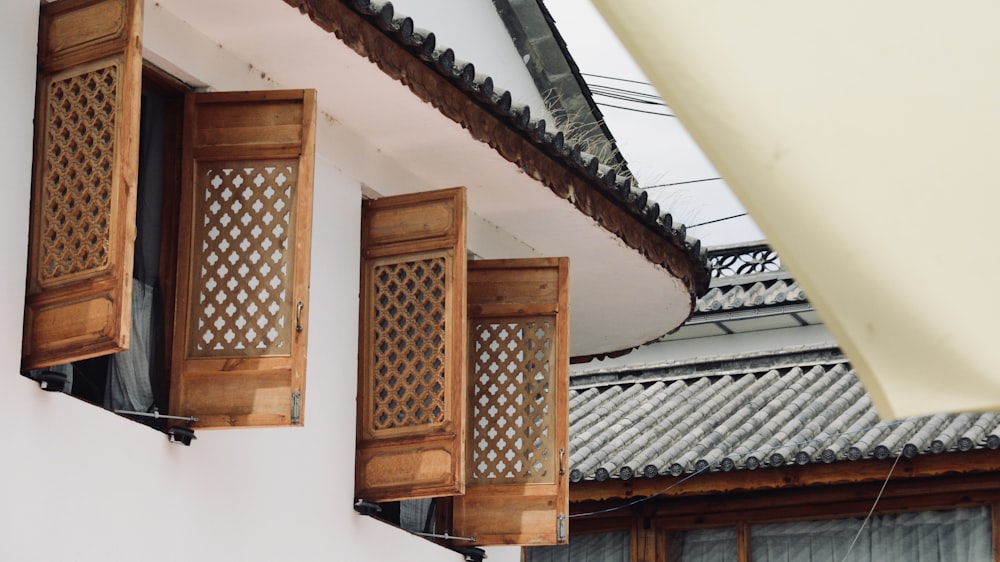 a couple of wooden doors on a building