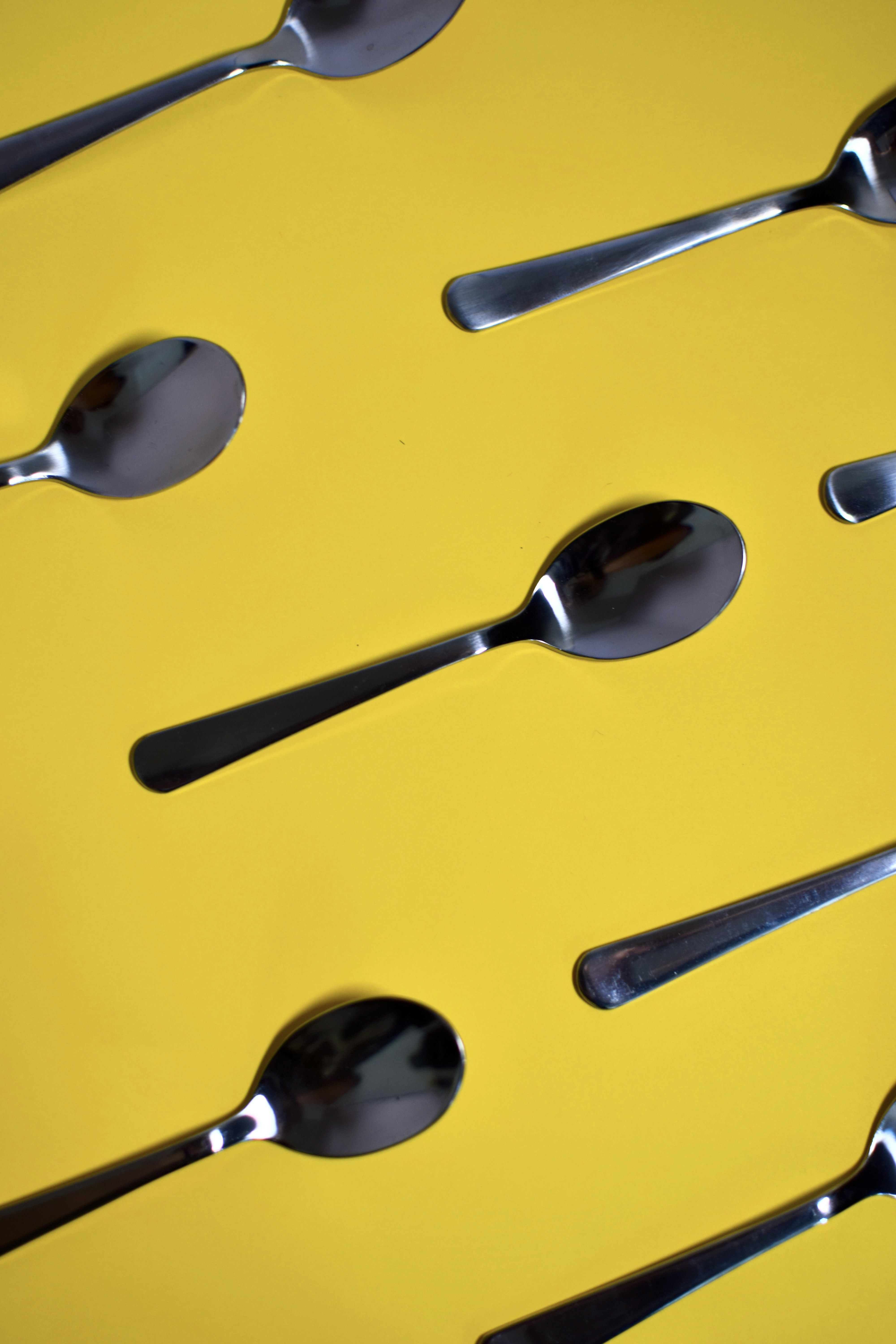 a yellow car with a pair of sunglasses on the hood