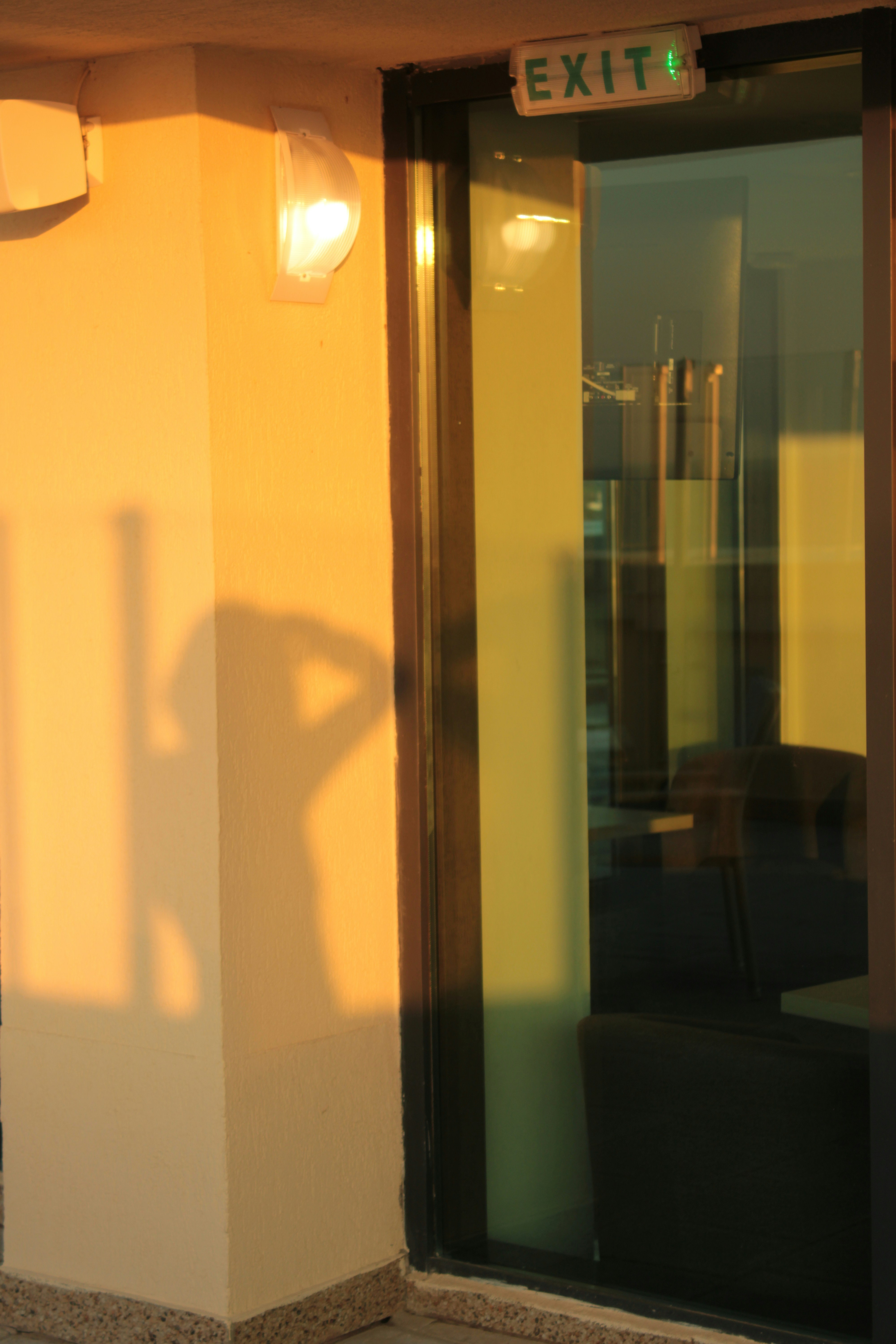 a glass door with a sign above it