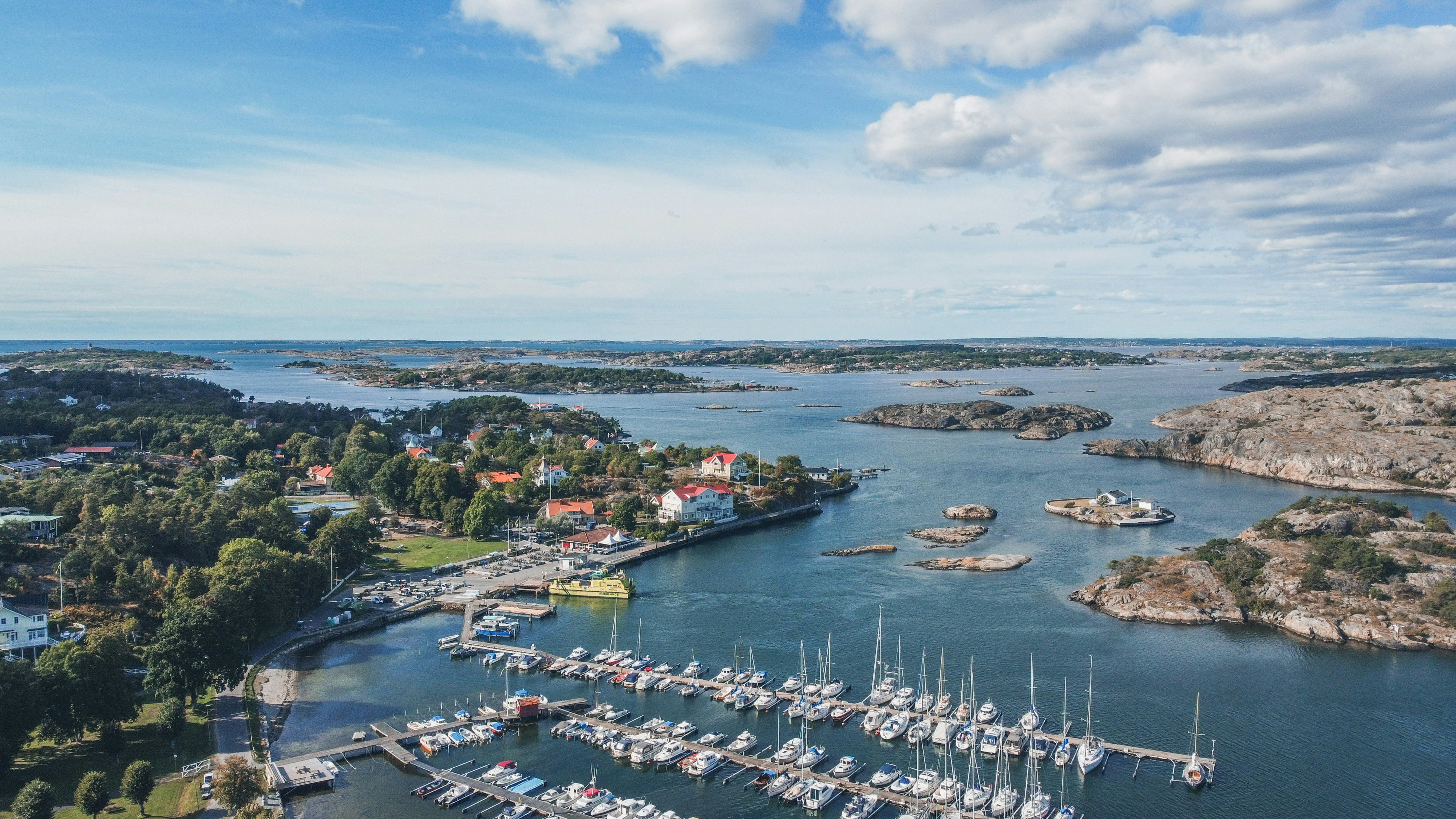 a body of water with boats and buildings along it
