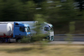 a couple of trucks on a road