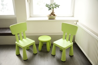 a couple of green chairs