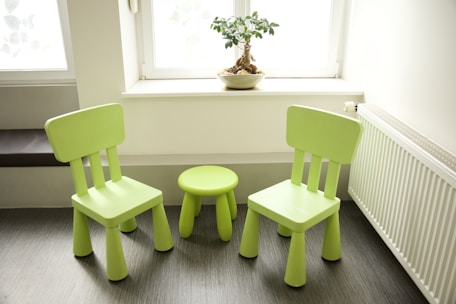 a couple of green chairs