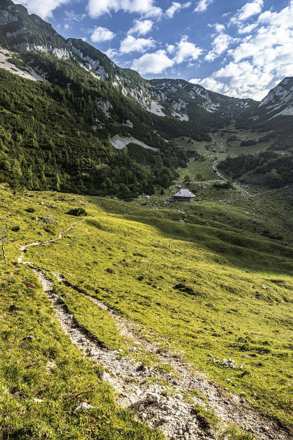 a house in a valley between mountains