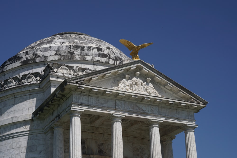 a building with a statue on top