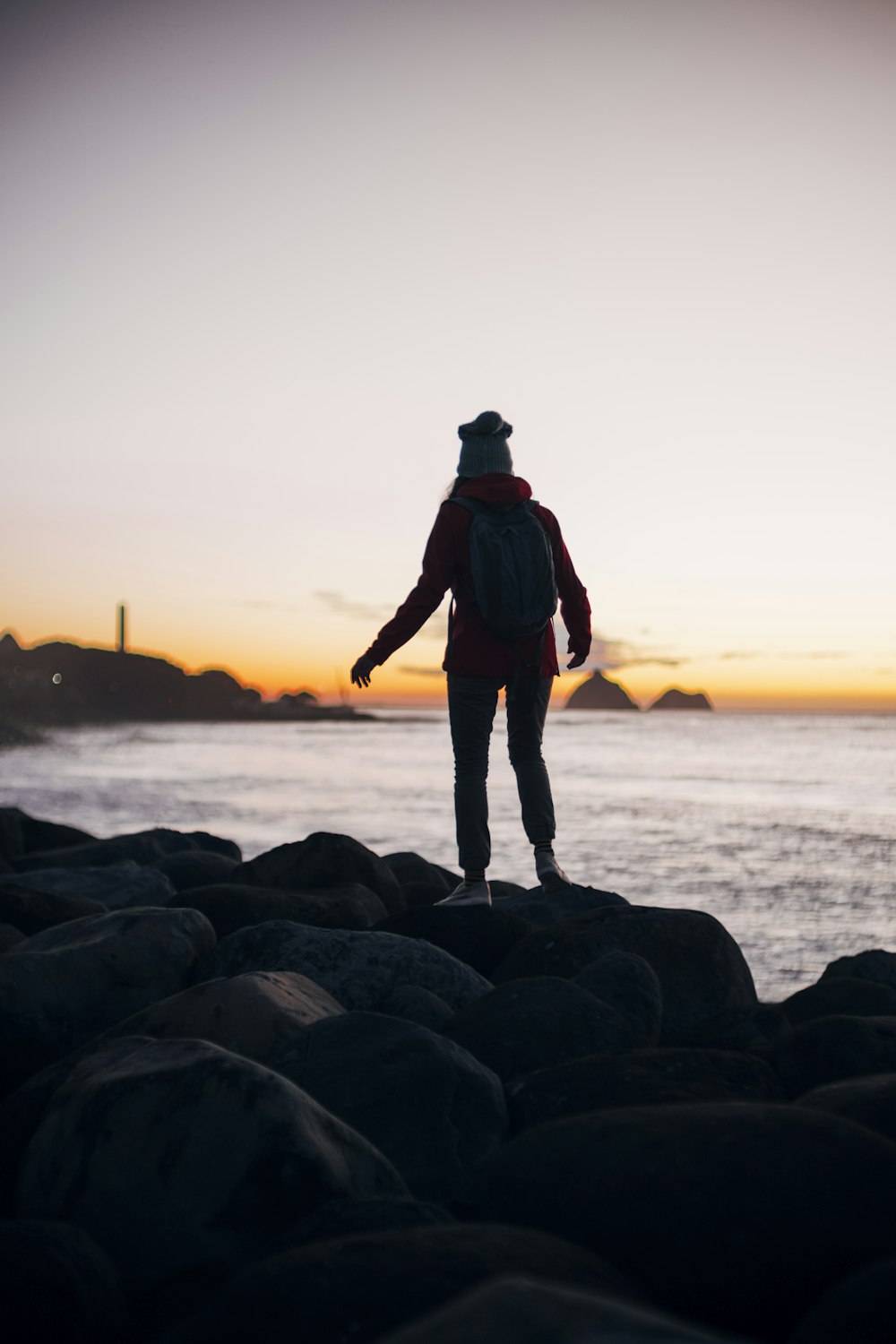 a person standing on a rock