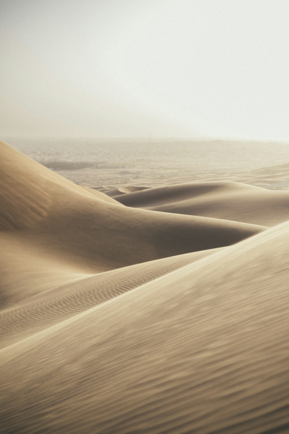 a sandy beach with waves crashing