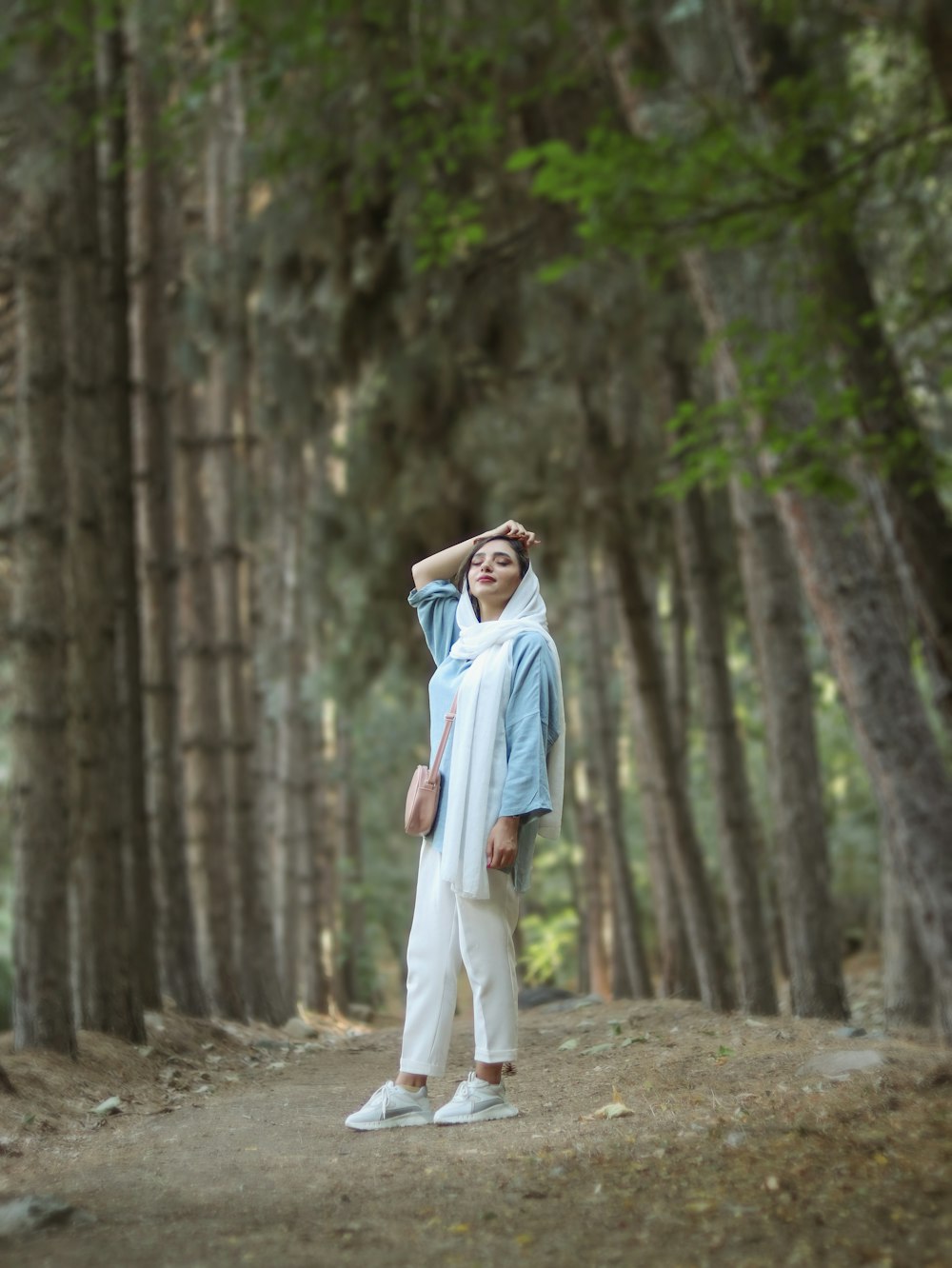 a man standing in a forest