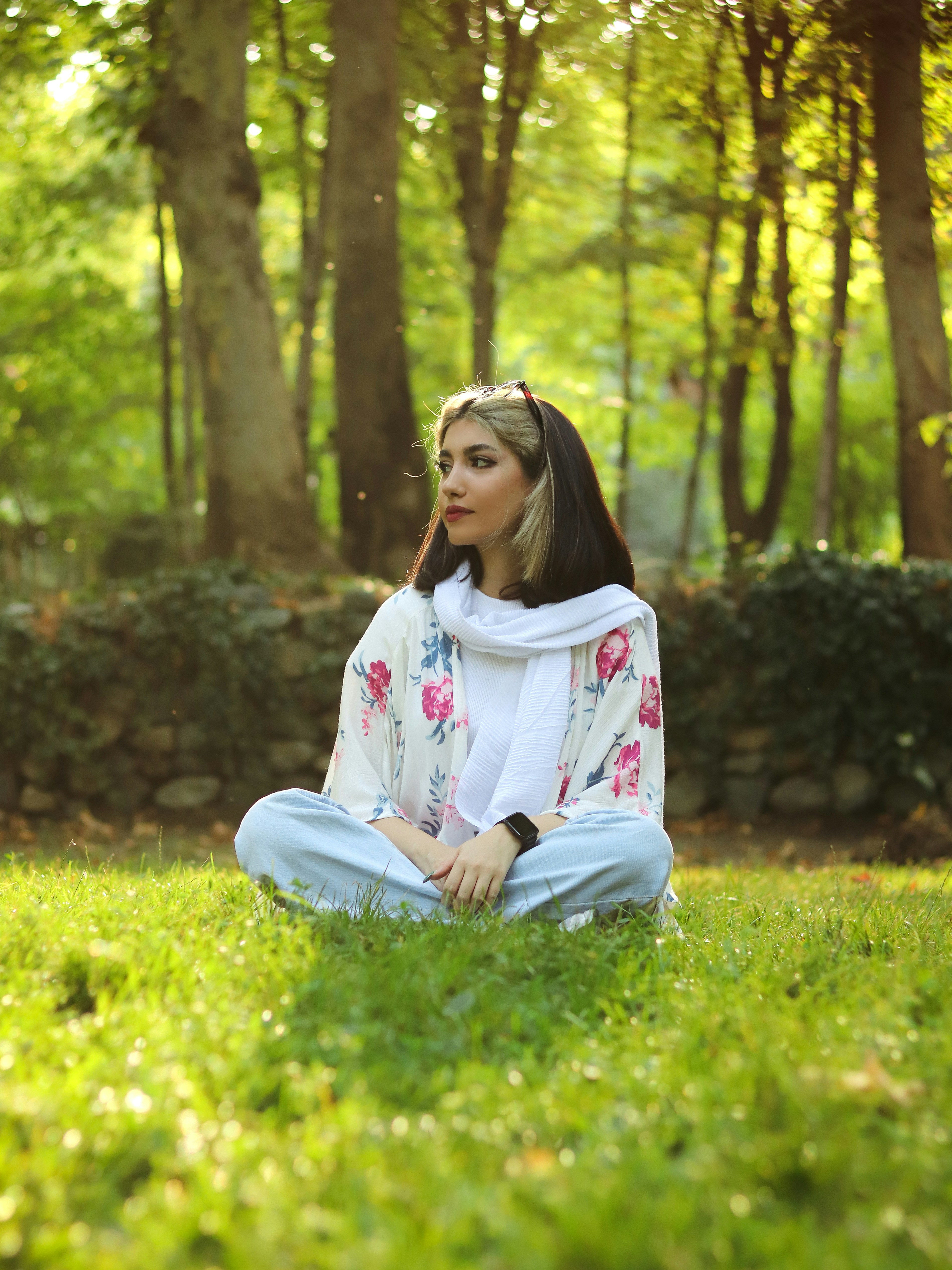 a person sitting in a grassy area