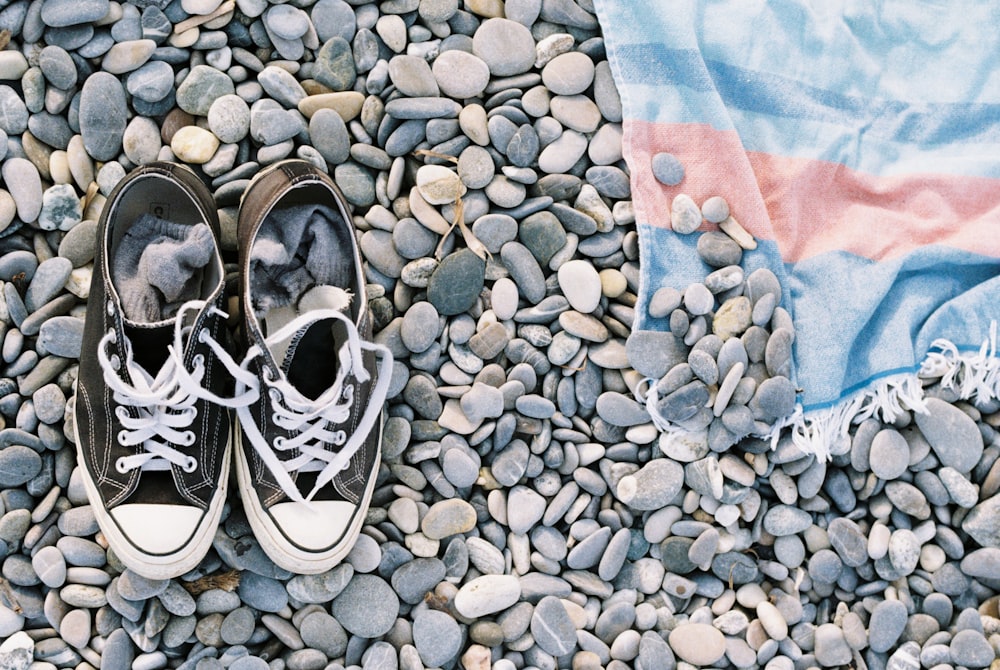 a pair of shoes on a rocky surface