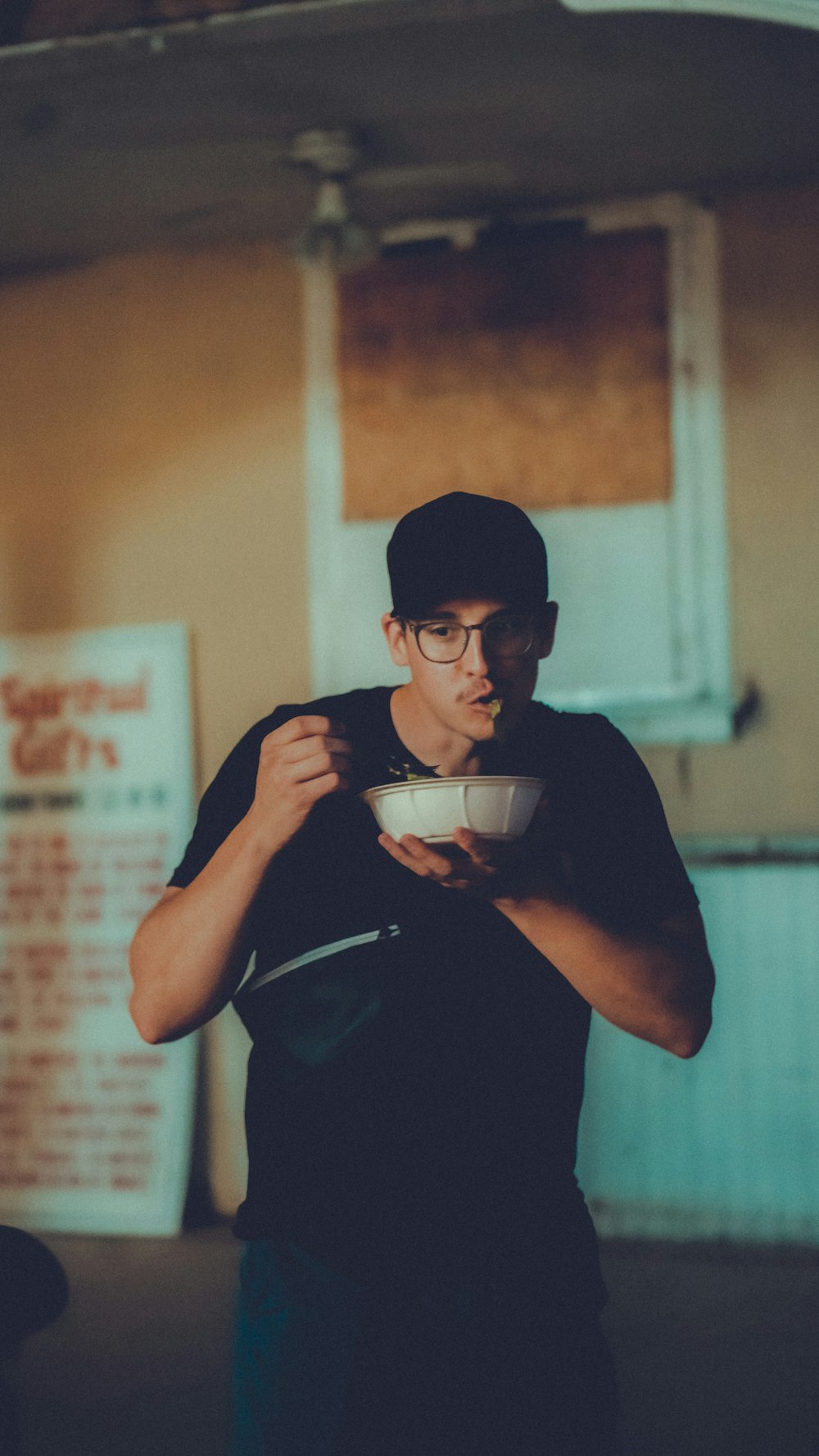 a man holding a cup