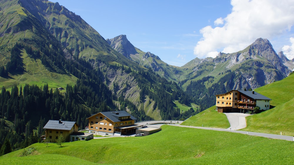 a house in a valley between mountains