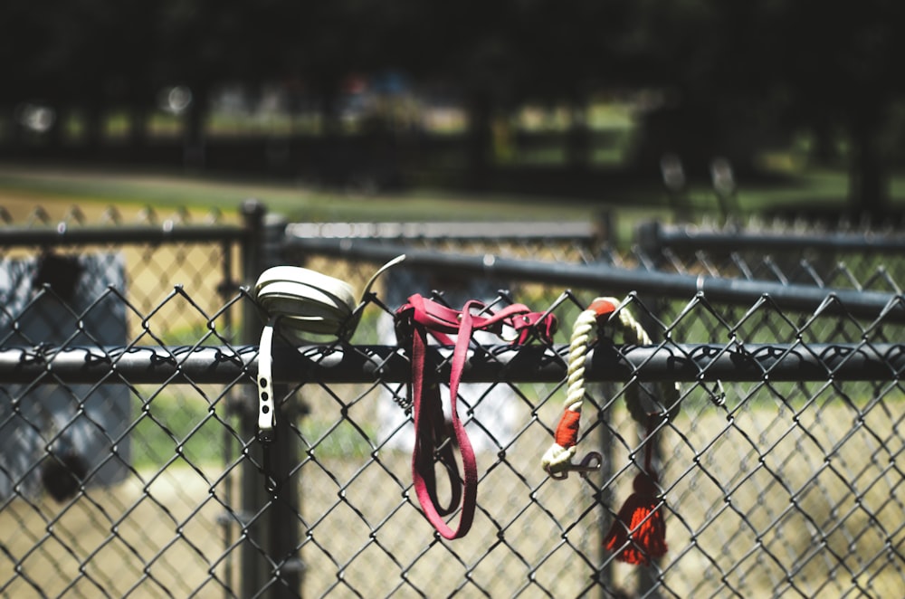 a fence with a red and white object on it