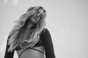 Artistic shot of hair strands glowing softly against a neutral, elegant background.