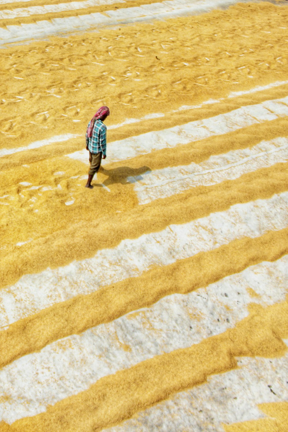 a person walking in the sand