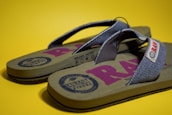 A happy customer wearing personalized flip-flops.