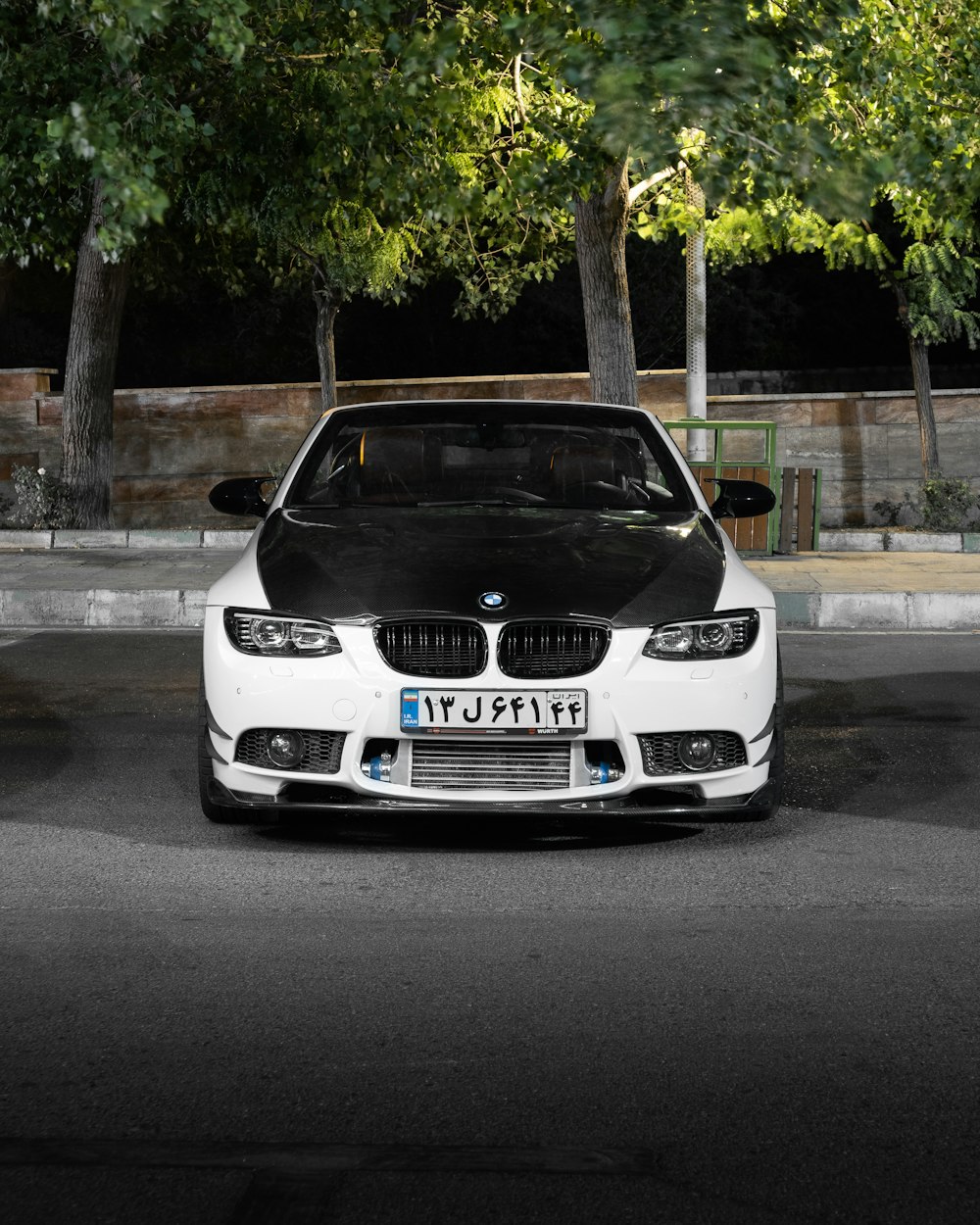 a white car parked on a street