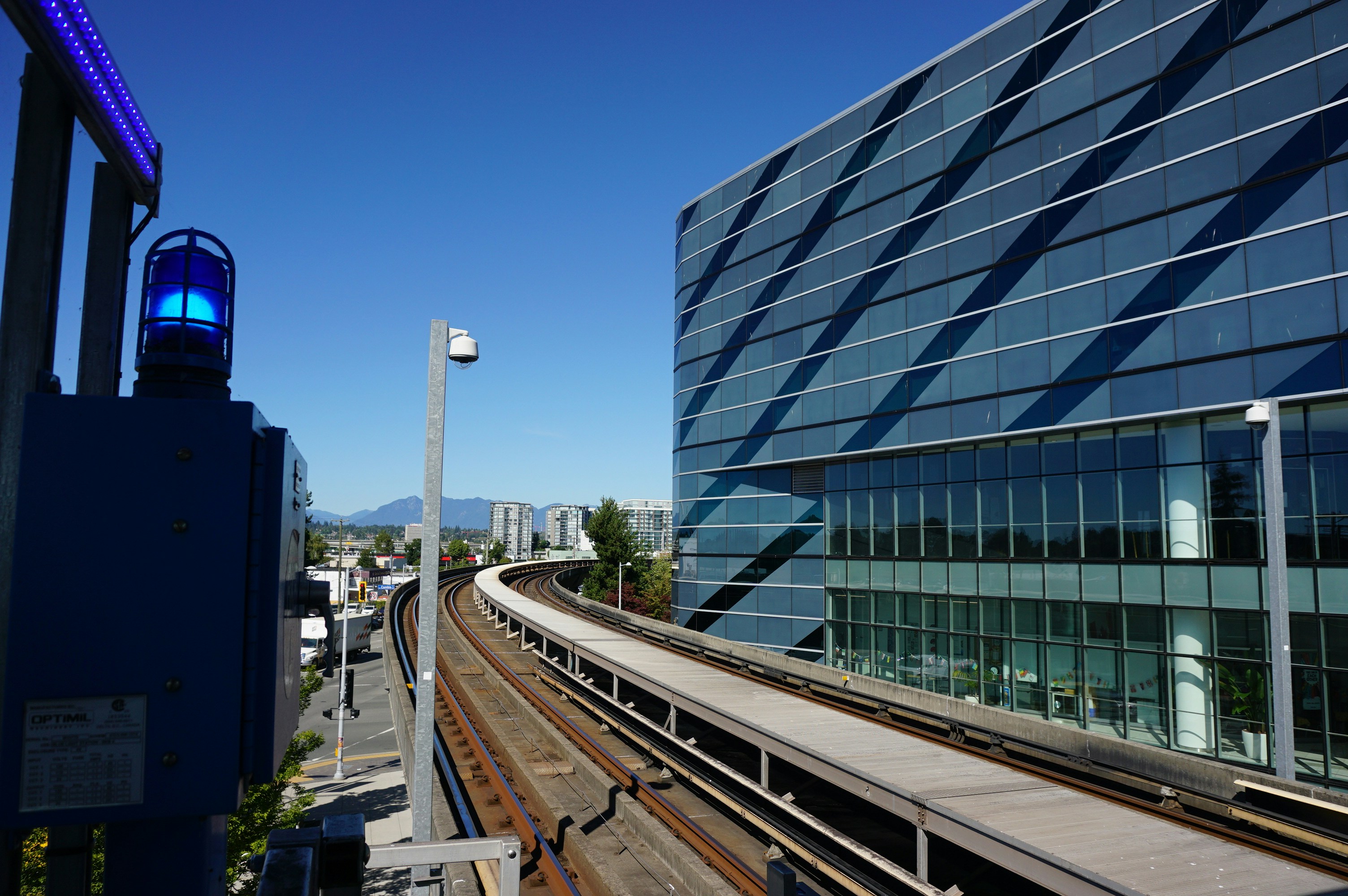 a train track next to a building