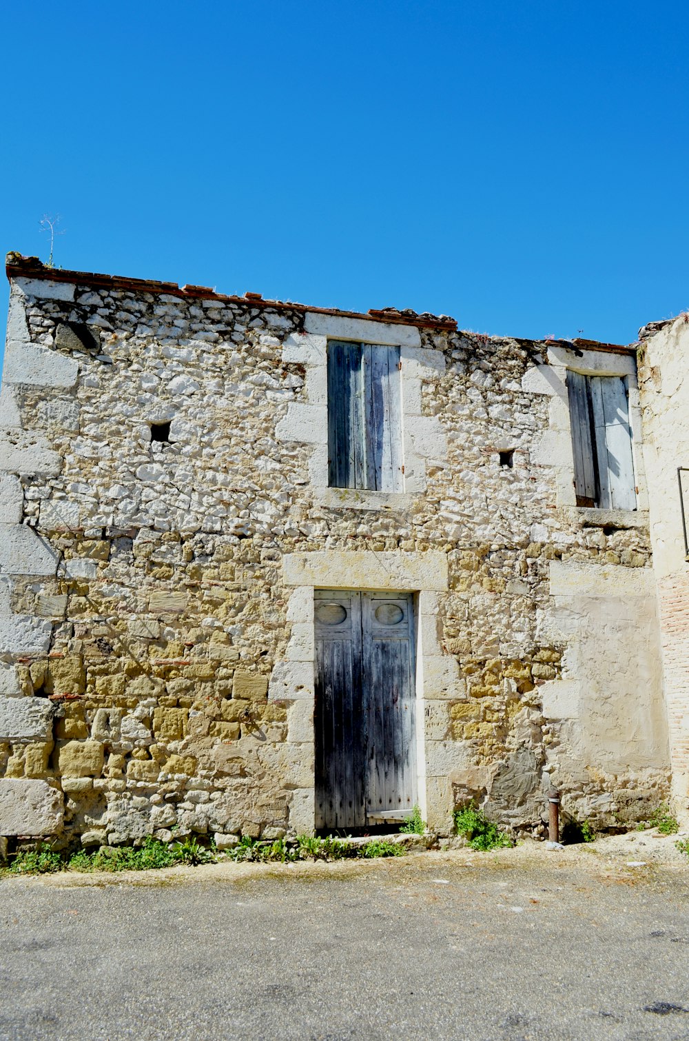 a stone building with a door